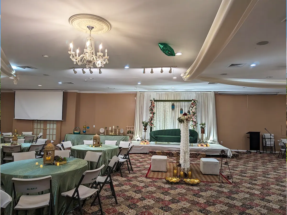 Luxurious banquet setup with maroon and white decor for awards gala and fundraiser.