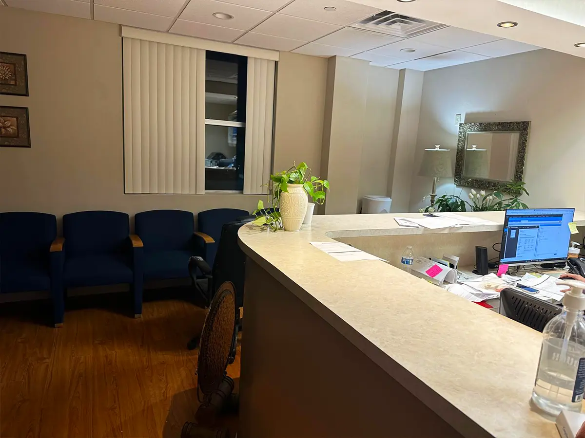 Professional reception area with organized workspace and welcoming decor for patient check-in.